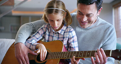 Buy stock photo Guitar, learning and child with father, lesson and family in home with music, development and creativity. Living room, musician and knowledge with love, support and bonding together on sofa with play