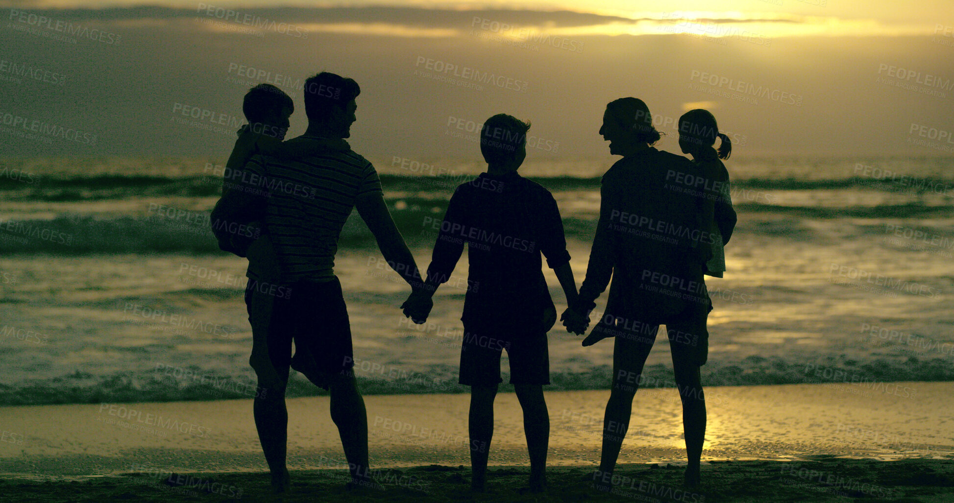 Buy stock photo Back, family and holiday to relax, beach and waves in morning, bonding and children with parents and love. Silhouette, sunrise and people with kids, holding hands and care in nature and California