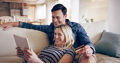 Buy stock photo Home, credit card and couple on sofa, tablet and smile with ecommerce, mortgage and banking. Finance, man and woman on couch, tech and buying with transactions, online reading and payment in lounge