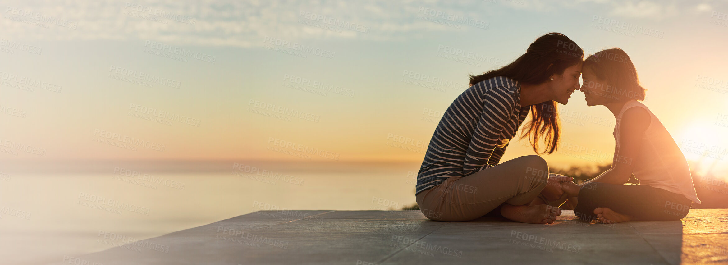 Buy stock photo Mother, child and forehead touch with sunset outdoor for love, bonding together and family connection. Woman, girl and holding hands for care, support and safety of summer vacation with sunrise view