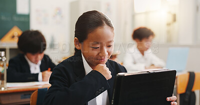 Buy stock photo Boy, tablet and reading in classroom with smile, education or e learning on web with research for project. School kids, learner and digital touchscreen for thinking, test and app at academy in Japan