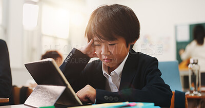 Buy stock photo School, tablet and sad child with stress, leaning and development in classroom. Assessment, anxiety and test with virtual language course, research and japanese student app for knowledge on website