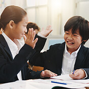 Children, high five and happy in classroom for learning, success and ...