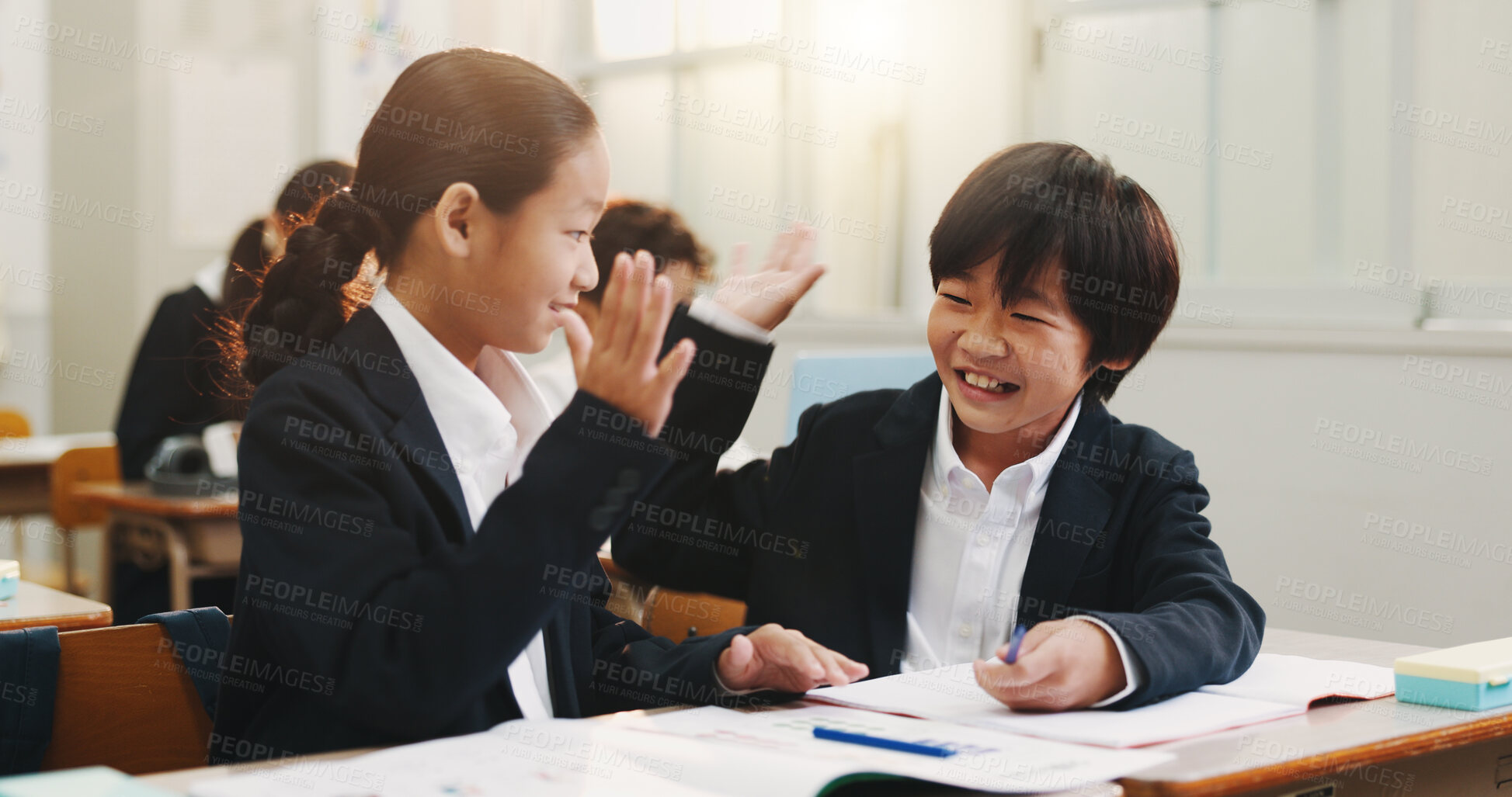 Buy stock photo Children, high five and happy in classroom for learning, success or study with problem solving for test. School kids, cheers and goals for teamwork, solution or friends with smile at academy in Japan