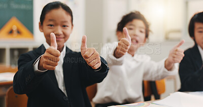 Buy stock photo Thumbs up, Japanese children and education in classroom for support, scholarship success and learning. Studying, youth and thank you with portrait of students at school for agreement and knowledge