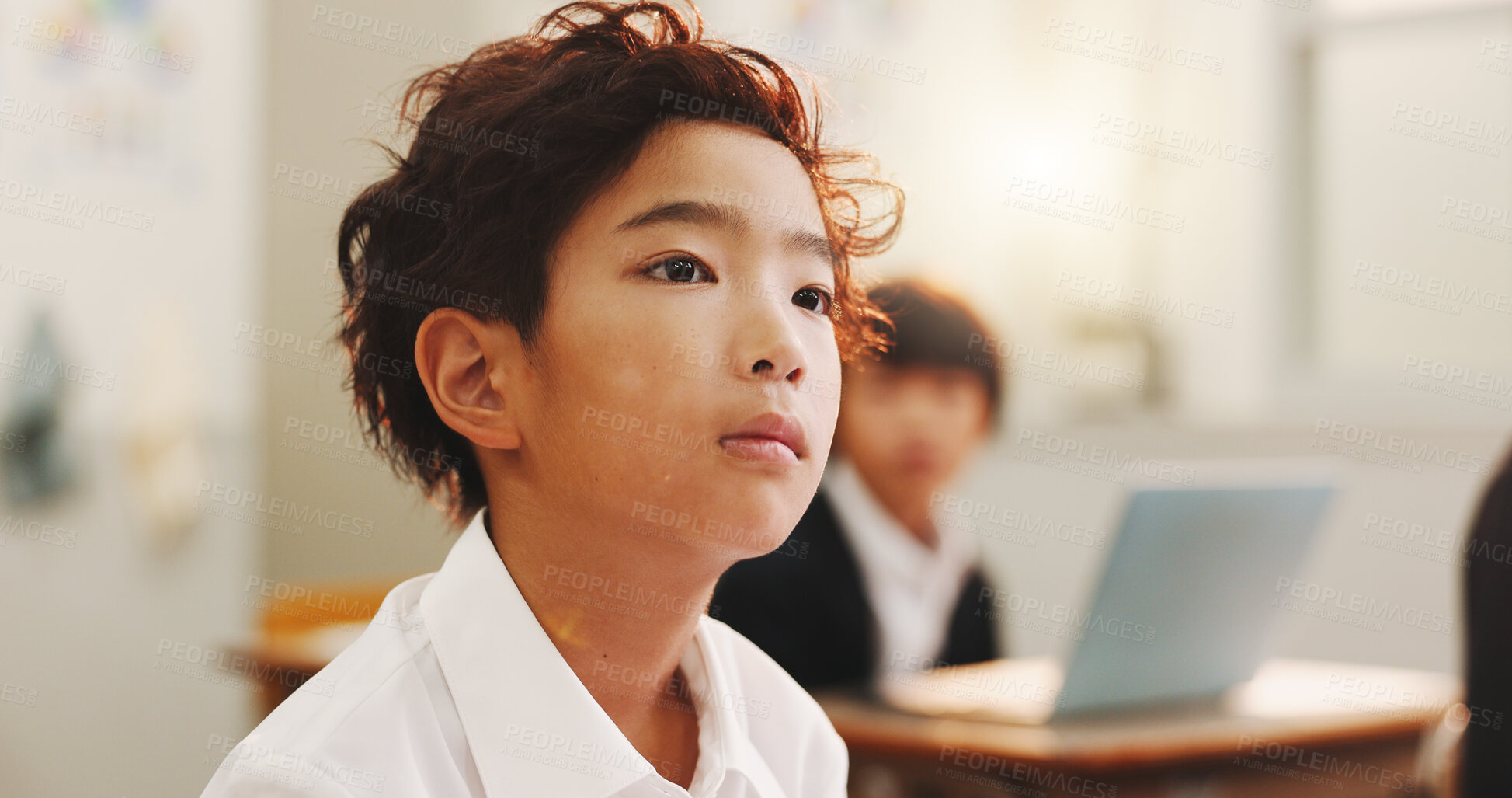 Buy stock photo Education, child or thinking in class for learning, daydreaming and distracted in lesson. Japanese boy, face or student in elementary school for development, growth and kid with ADHD in academy