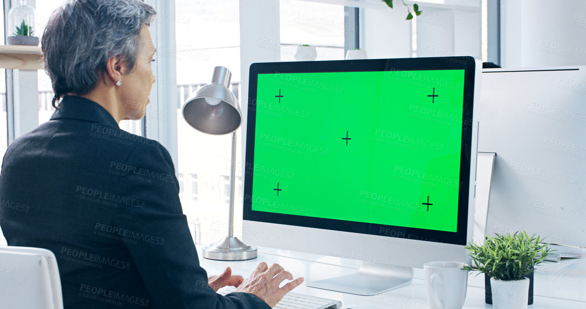 Buy stock photo Green screen, computer and businesswoman in office with research for stock market. Technology, tracking markers and mature female financial advisor on desktop for capital gain investment mockup