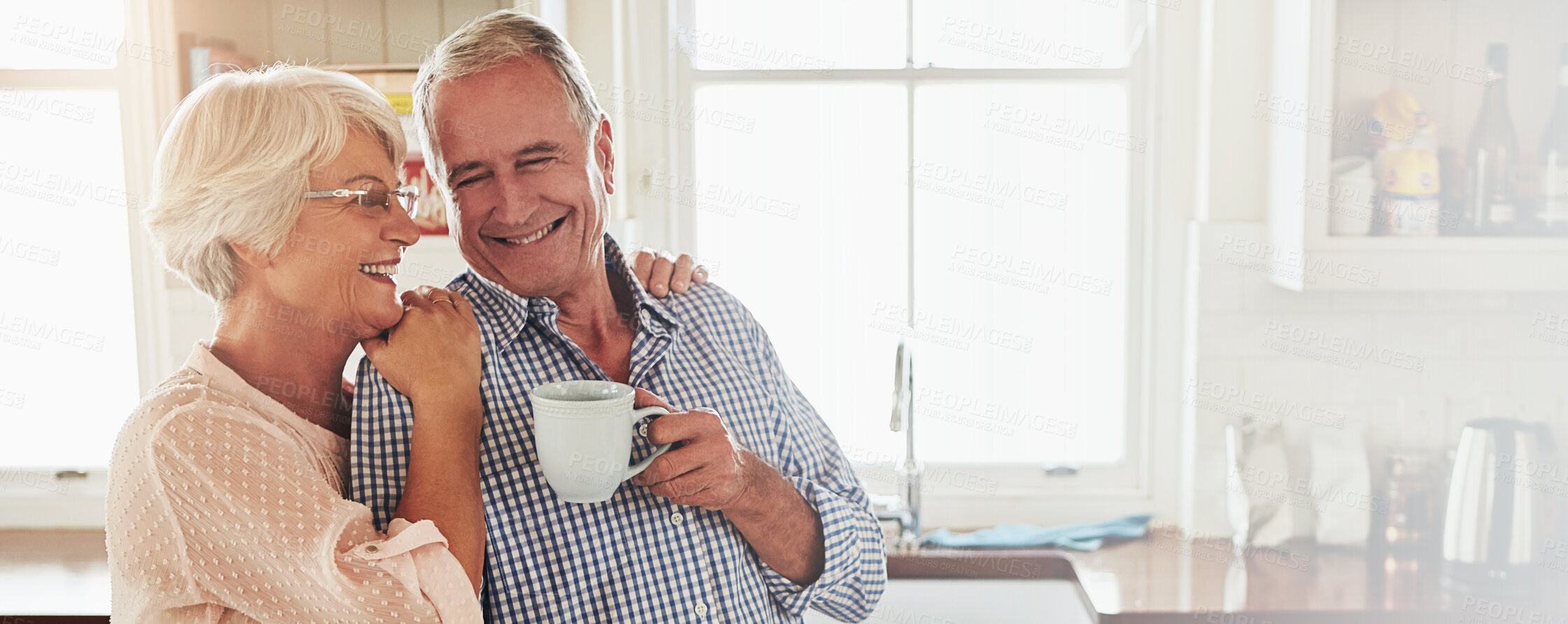 Buy stock photo Coffee, kitchen and smile with senior couple in home together for love, retirement or support. Drink, hug or laughing with old man and woman in apartment for morning bonding, relax or wellness