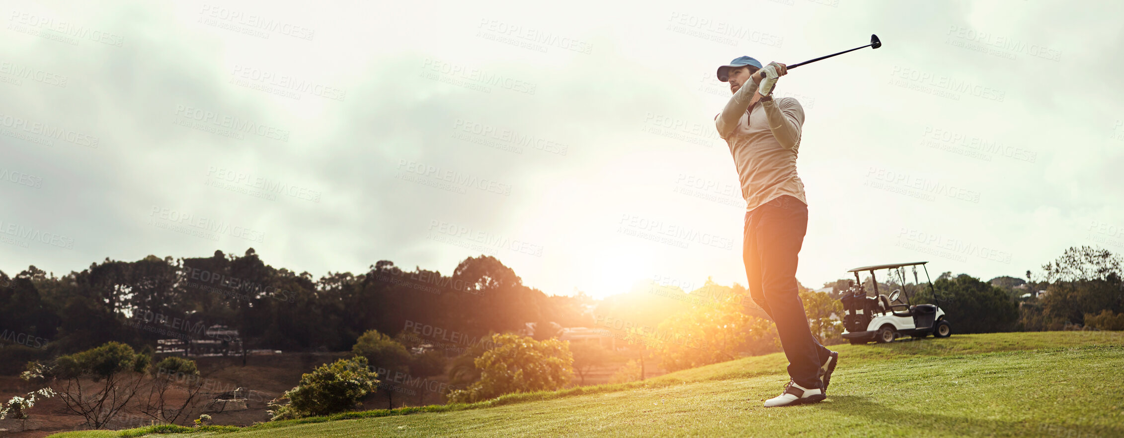 Buy stock photo Man, swing and play golf on field for sports, fitness and training with recreation, exercise and fun. Male person, golfer and strike club on outdoor course for competition, workout and practice game