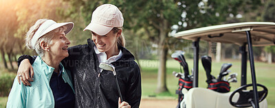 Buy stock photo Mother, daughter and hug for golf outdoor of sports training, bonding together and fitness hobby. Mature, women and embrace of putter for family activity, fun competition and match practice in nature