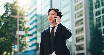 Buy stock photo Asian, businessman or talking with phone call in city for discussion, proposal or conversation. Japanese, man or employee listening on mobile smartphone for business deal, chat or negotiation in town