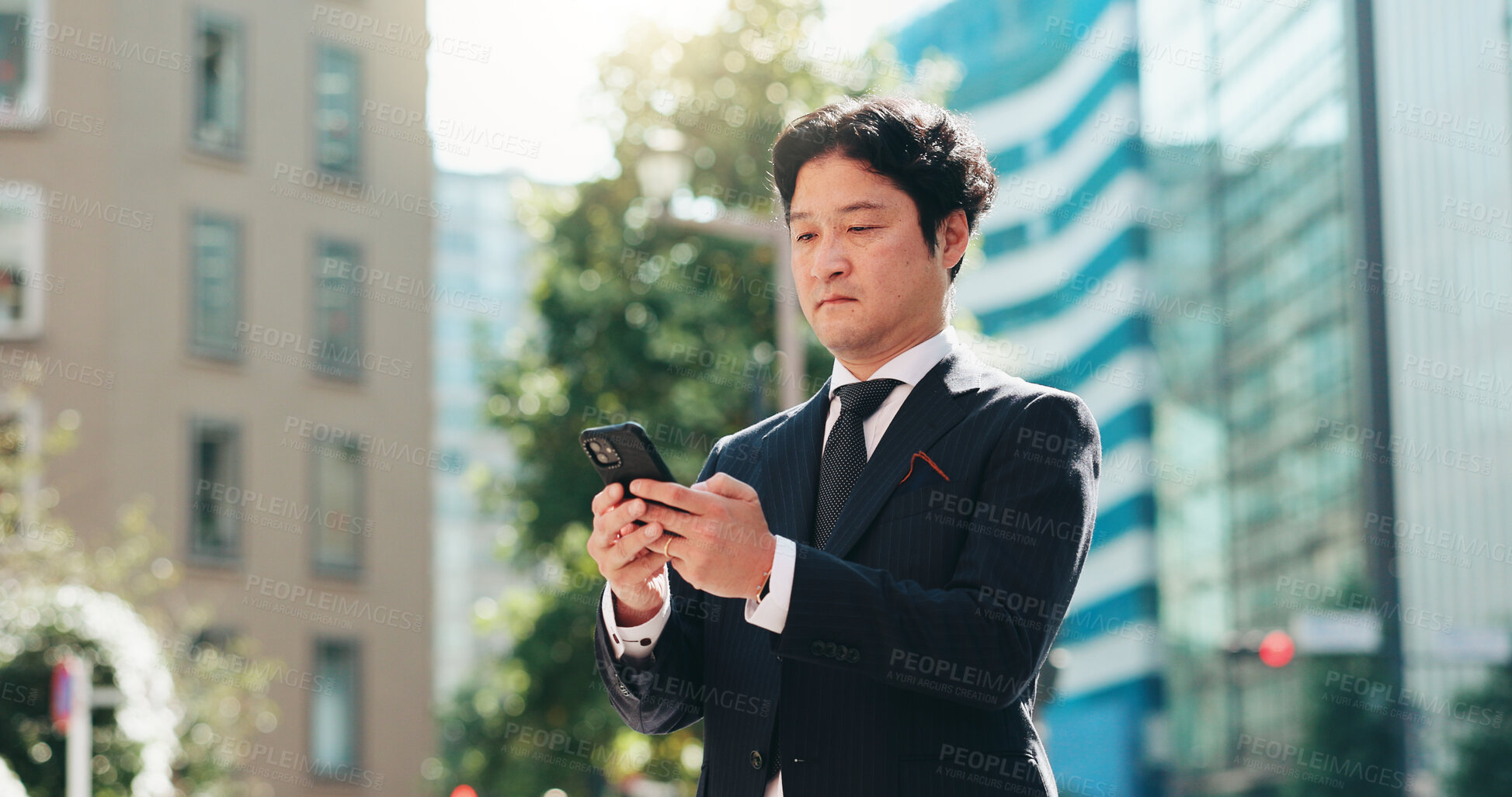 Buy stock photo Man, reading and phone in city for business, travel and research for urban development in Tokyo. Mature investor, mobile and scroll in Japanese town for news, investment opportunity or economy growth