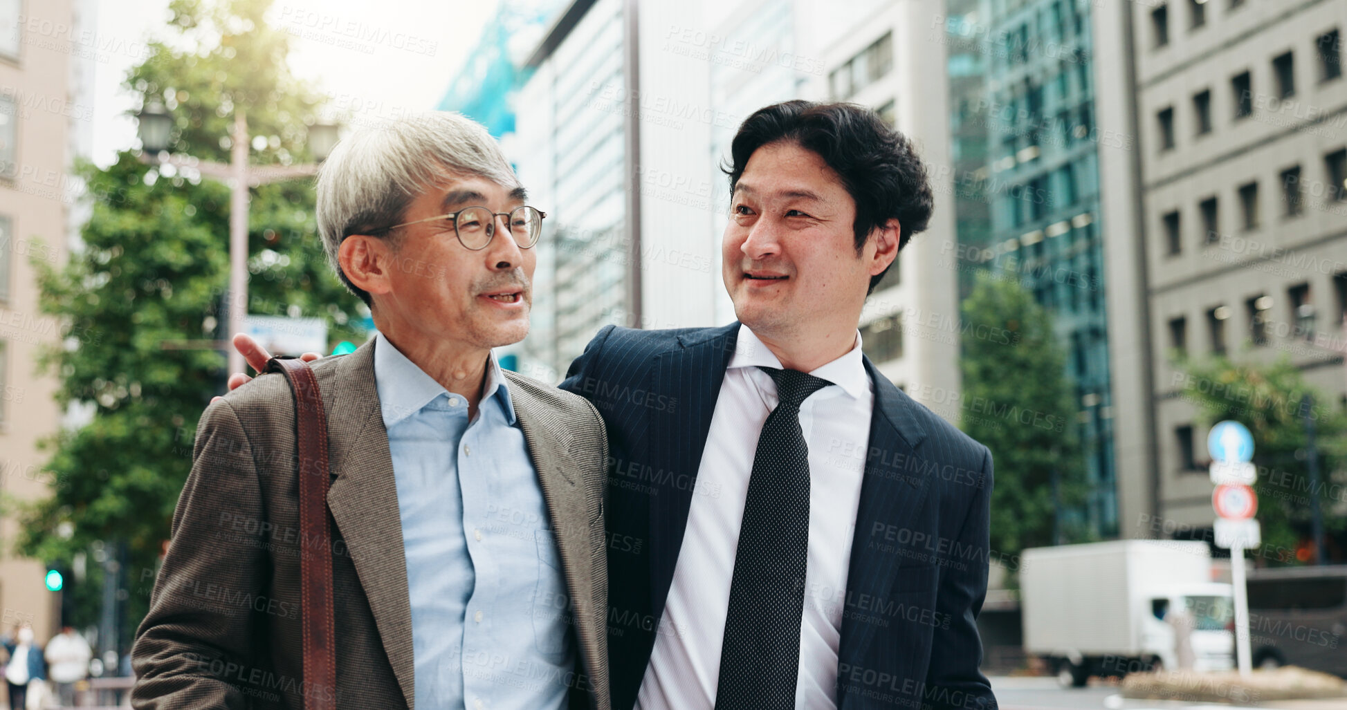 Buy stock photo Asian, walking and business people in city talking for conversation, travel or bonding. Smile, discussion and professional Japanese colleagues speaking of urban project together commuting in Tokyo