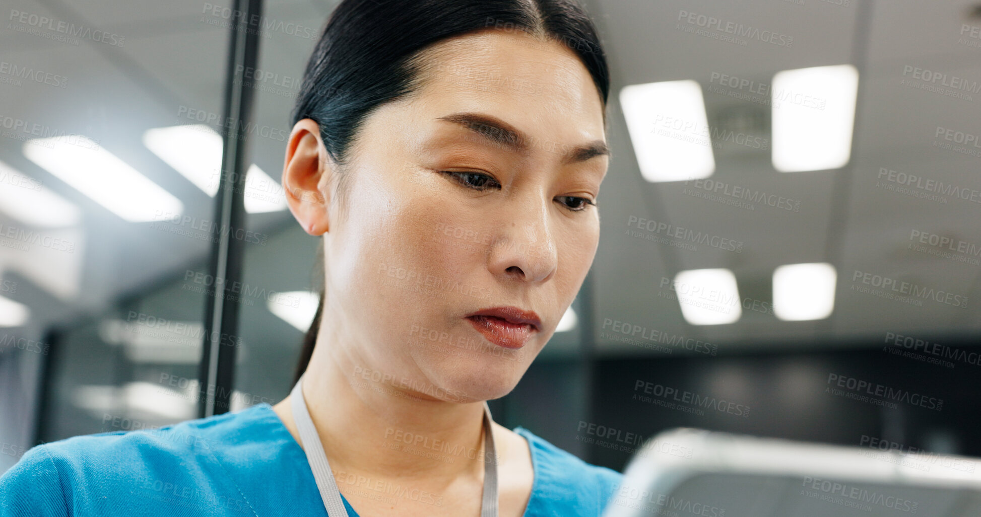 Buy stock photo Nurse, tablet and healthcare of Japanese woman reading with planning, web document and medical checklist in hospital. Surgeon, nursing and online research for health, wellness and clinic care help