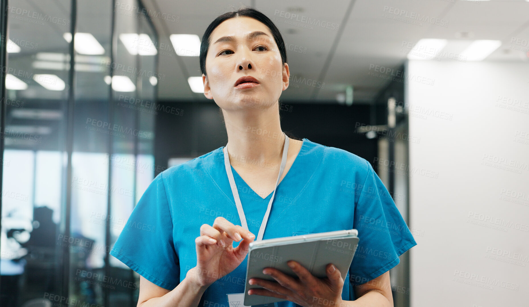 Buy stock photo Nurse, tablet and clinic checking of Japanese woman with thinking, web document and medical checklist in hospital. Surgeon, nursing and online research for health, wellness and care with professional