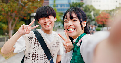Buy stock photo Selfie, city and japanese couple with peace sign, emoji and happy from sightseeing and profile picture. Social media, online and people on urban road with partner on vacation and holiday with joy