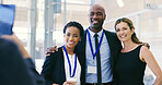 Happy, business people and hug with team for picture, photography or memory at convention or workshop. Group, employees or colleagues with smile for capture moment at training seminar or workplace