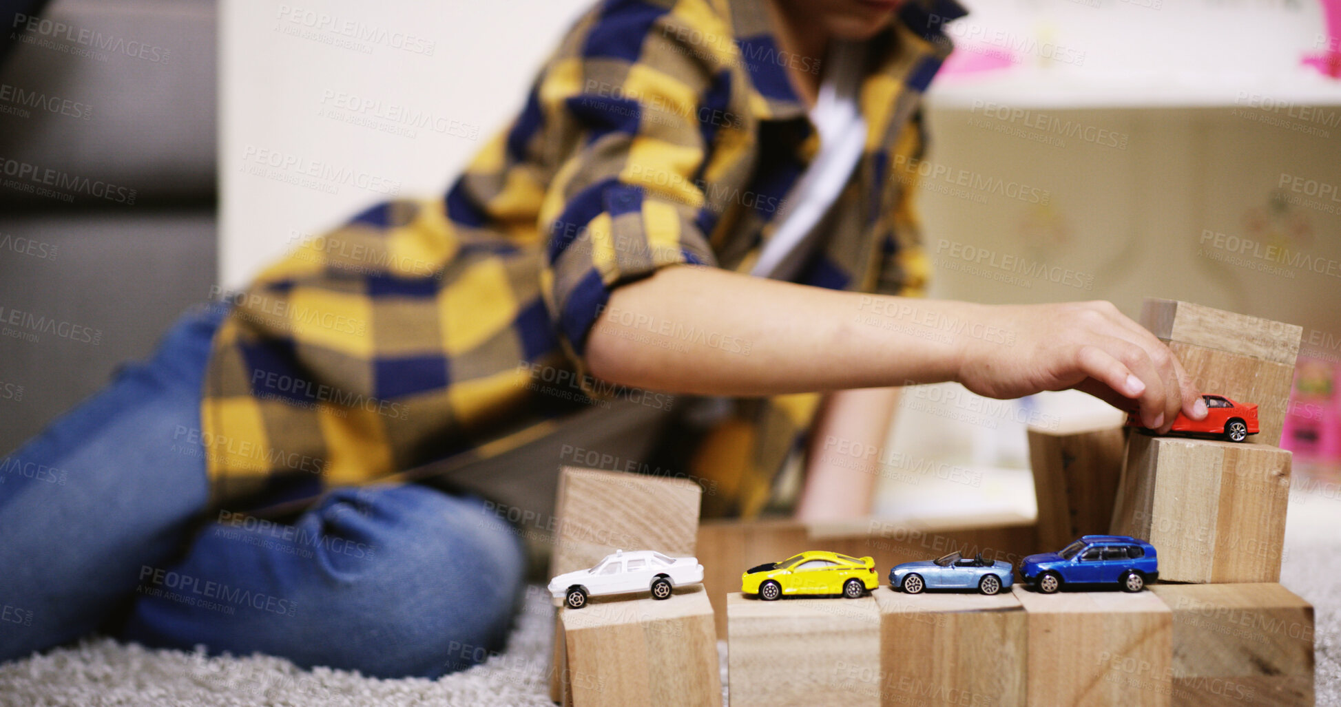 Buy stock photo Child, play and fun with toy car, house and activity with fantasy racing game, hand and eye coordination. Kid, boy and vehicle learning with transport knowledge, apartment and fine motor skills