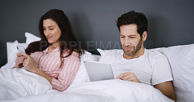 Buy stock photo Phone, tablet and couple relaxing in bed in home for networking, connectivity or browsing online. Happy, rest and young people with cellphone and digital technology in bedroom for contact in house.