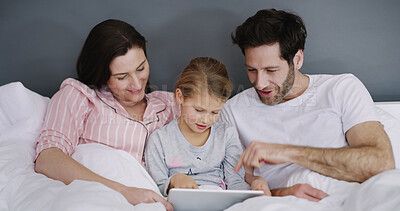 Buy stock photo Relax, tablet and kid with parents in bed in home for watching show, film or video online. Happy, rest and girl child with mom and dad for streaming movie with digital technology in bedroom in house.