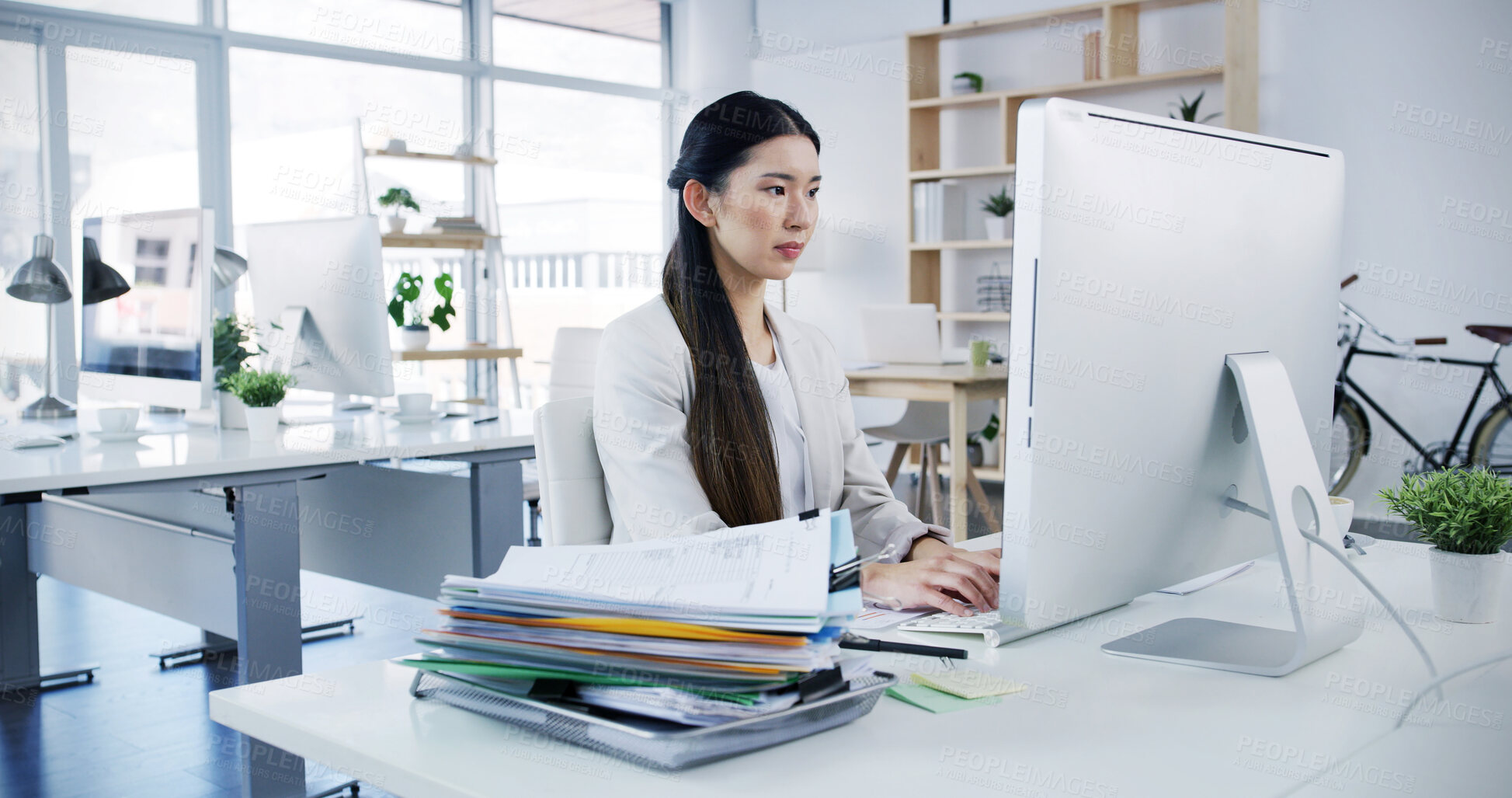 Buy stock photo Woman, computer and typing in office for business, administration and financial planning. Asian accountant, tech and documents in agency for feedback, company banking and payment management for audit