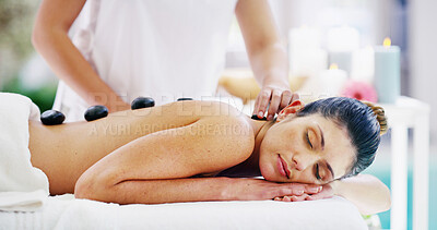 Buy stock photo People, relax and hot stone at spa outdoor with healing muscle tissue, stress relief and massage wellness. Woman, sleeping and warm rocks with holistic treatment, spiritual detox and natural recovery