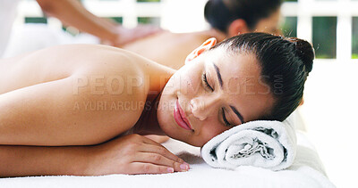 Buy stock photo Woman, spa and relax for massage with eyes closed or smile for luxury, self care and wellness. Female person, customer and break or resting at resort for body therapy service, treatment and peace