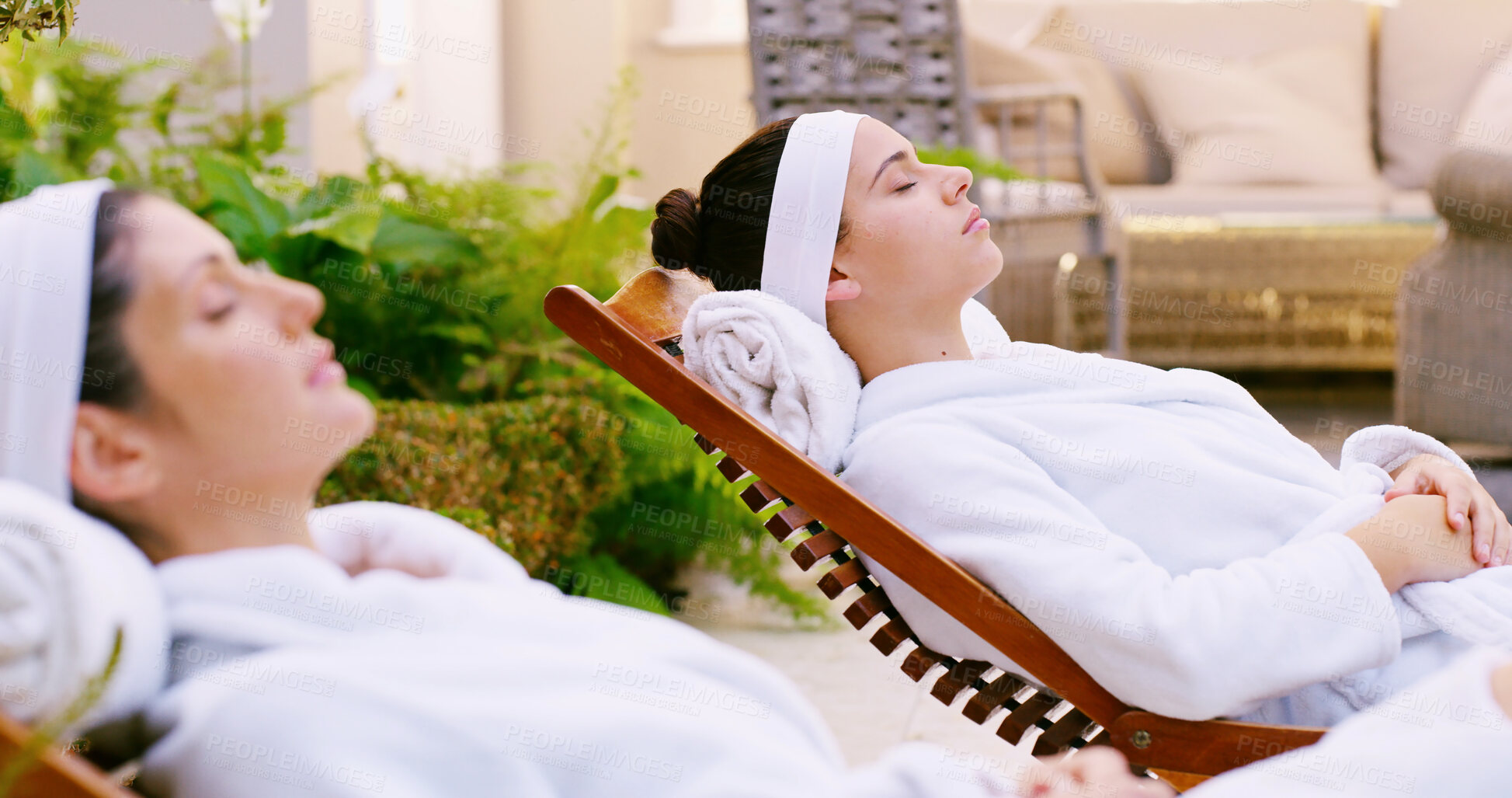 Buy stock photo Resort, woman and resting in robe by spa for weekend break, stress relief and luxury treatment outdoor. Friends, person and relax at beauty lodge for wellness, pamper and self care on holiday getaway