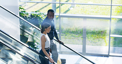 Buy stock photo Business, people and talking on escalator in office with project planning, meeting briefing or friendly chat. Professional, employees and discussion on moving stairs for networking in work building