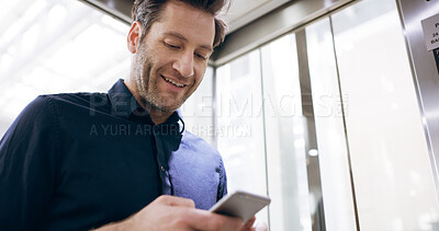 Buy stock photo Business, elevator or man with phone in office for checking notifications, network connection or mobile chat. Employee, person or smartphone for online networking, reading email or commute to meeting