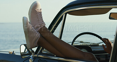 Buy stock photo Person, legs and feet with car window for road trip, holiday or vacation by ocean coast in nature. Driver, shoes and relax with beach view in vehicle for transport, travel or tourism by outdoor sea