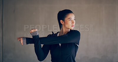 Buy stock photo Warm up, fitness and woman in city for workout, running or training with weightloss. Serious, sports and female athlete stretching arms with outdoor exercise by wall in town for health or wellness.