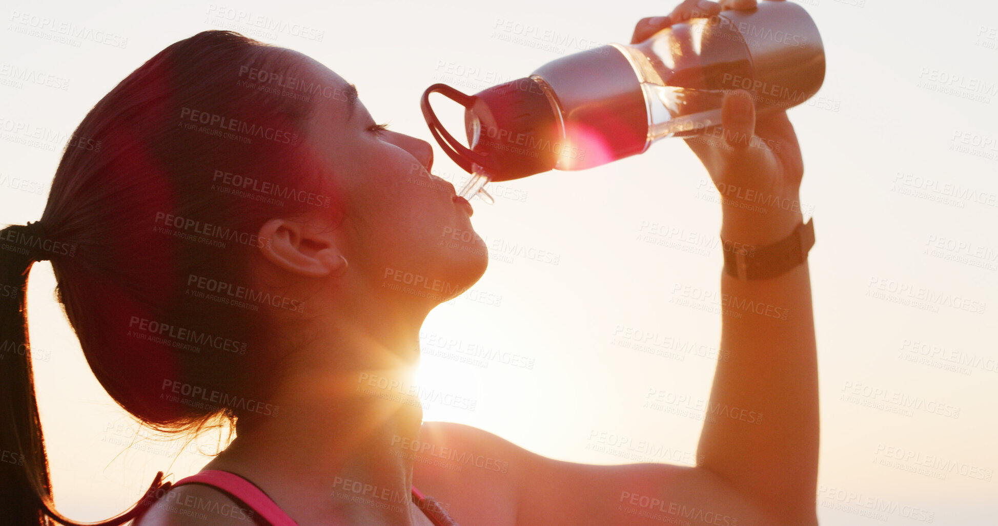 Buy stock photo Woman, fitness and drinking with water bottle in sunset for hydration, mineral liquid or refreshment. Active, female person or runner with lens flare, beverage or thirst for natural sustainability