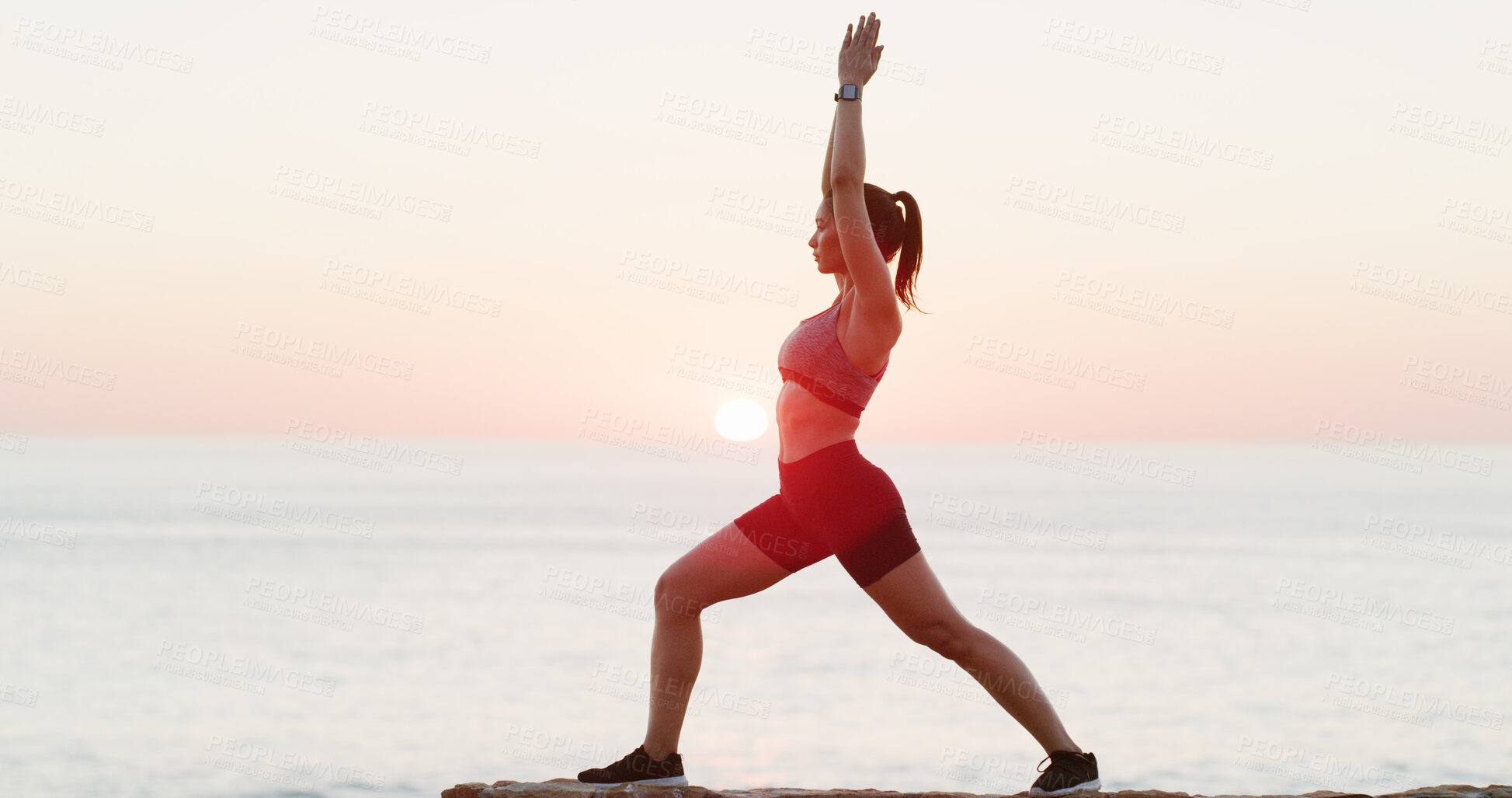 Buy stock photo Athlete, woman and stretching with yoga at ocean of spiritual fitness, mindfulness and holistic healing. Active girl, warm up and sunset with pilates activity, mental health and balance for wellness 