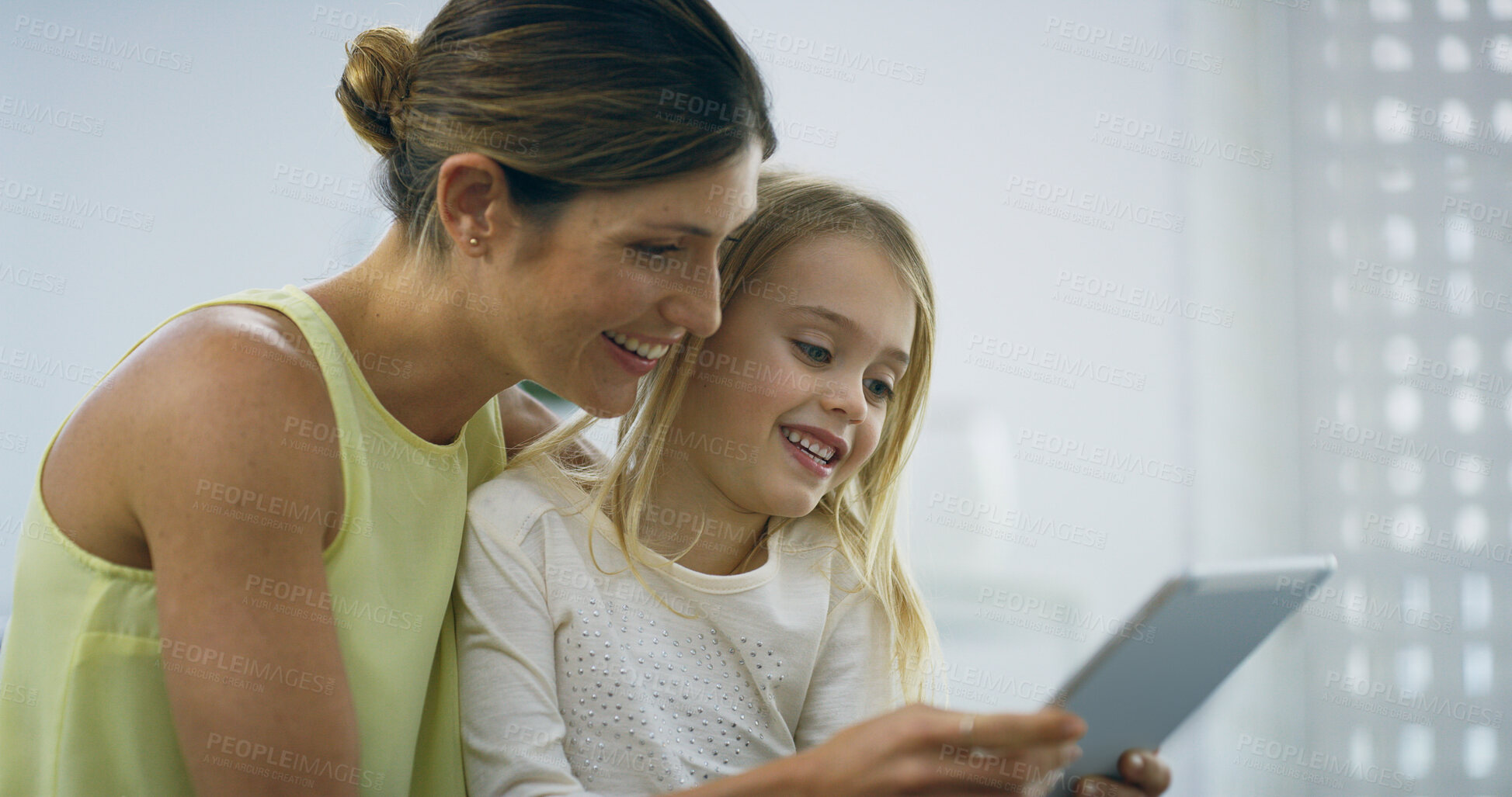 Buy stock photo Mother, girl and tablet for streaming in home, funny video and online for meme on social media. Mommy, daughter and together for reading ebook comedy on website, lounge bonding and games on couch