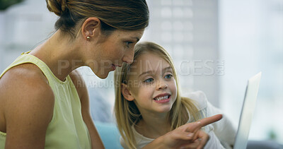 Buy stock photo Mother, girl and tablet for learning in home, video education and online for lesson support. Mommy, daughter and together for reading ebook on website, lounge bonding and pointing to app for story