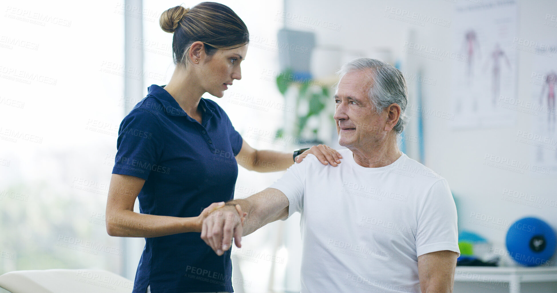 Buy stock photo Physiotherapy, woman and senior man with shoulder pain for stretching, help and care in office. Chiropractor, elderly patient or advice in practice for rehabilitation, healing or arm exercise in exam