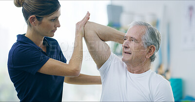 Buy stock photo Physiotherapy, woman and elderly man with shoulder pain for stretching, help or care in office. Chiropractor, senior patient or support in practice for rehabilitation, healing or arm exercise in exam