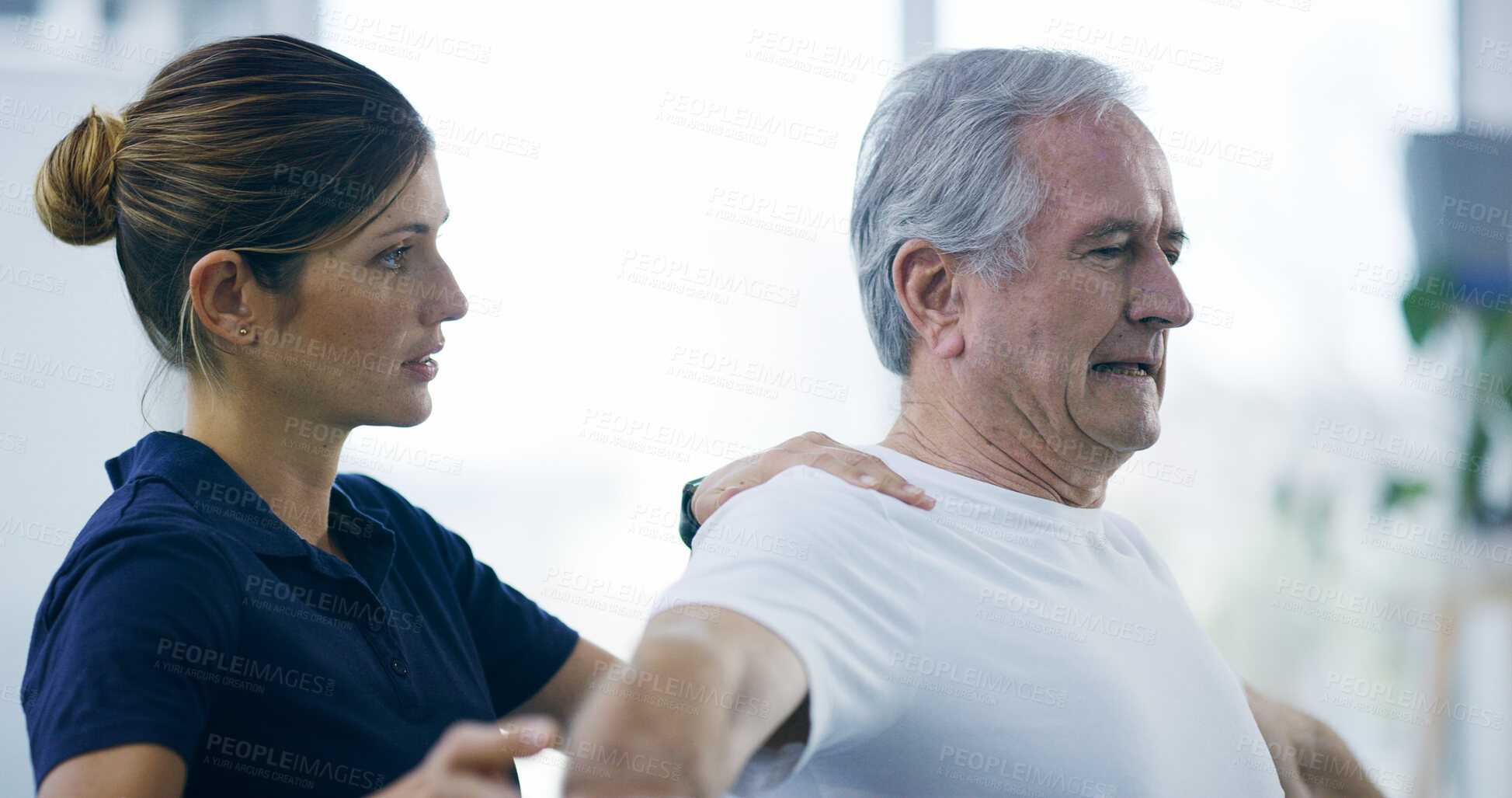 Buy stock photo Woman, old man and physiotherapy stretching at clinic, shoulder consultation and rehabilitation. Specialist, elderly person and examine physical strain for healthcare, chiropractor and assessment