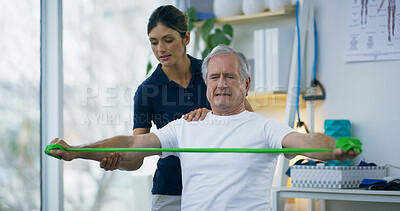 Buy stock photo Resistance band, senior man and physiotherapist with consultation, wellness or recovery. Employee, physical therapy or client with healthcare, support or healing with strength training or stretching