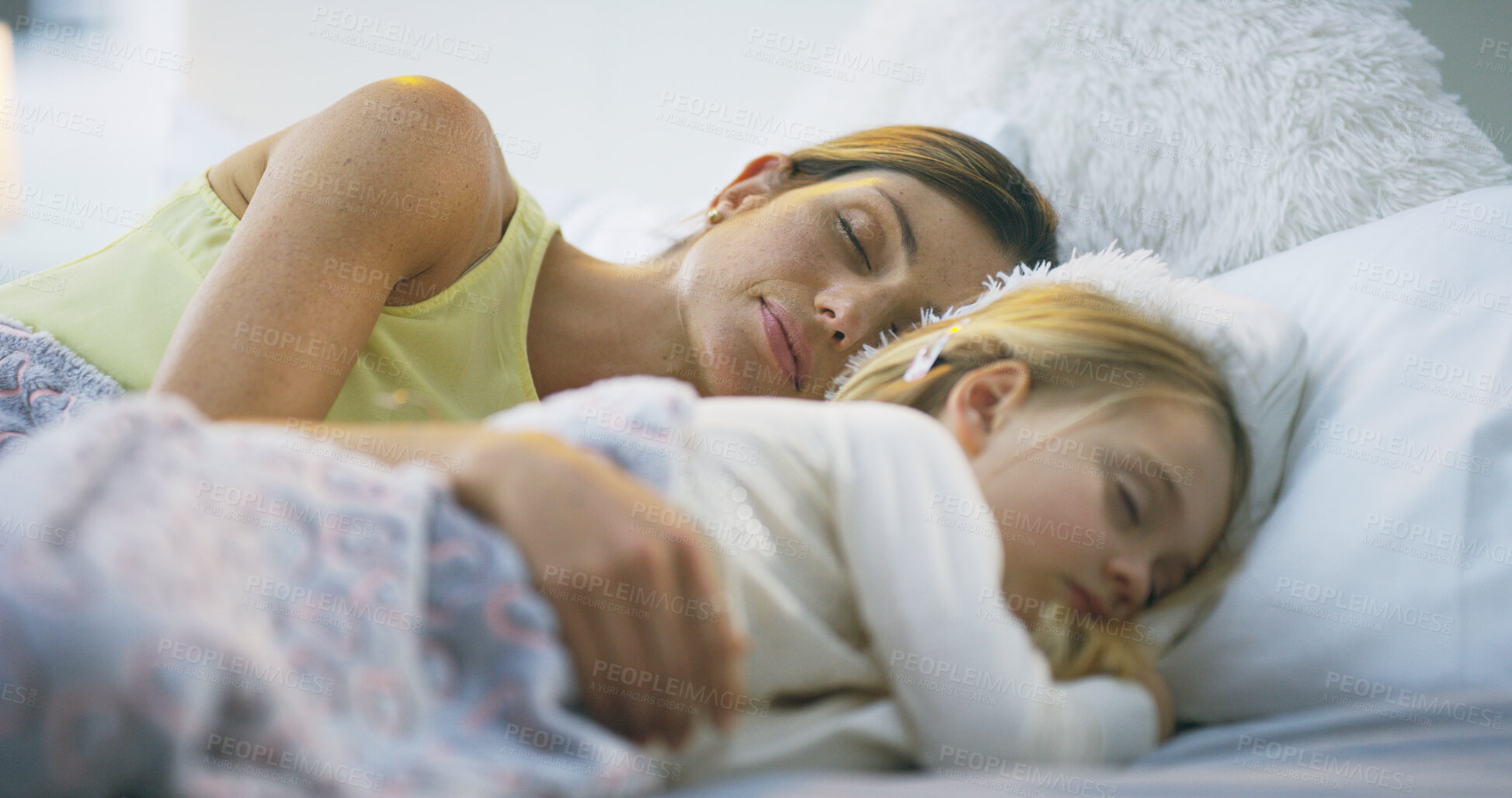 Buy stock photo Mama, daughter and sleeping together in bedroom, peace and support in dream of family home. Mommy, girl and late weekend morning with child for nap, comfort and embrace security in relationship