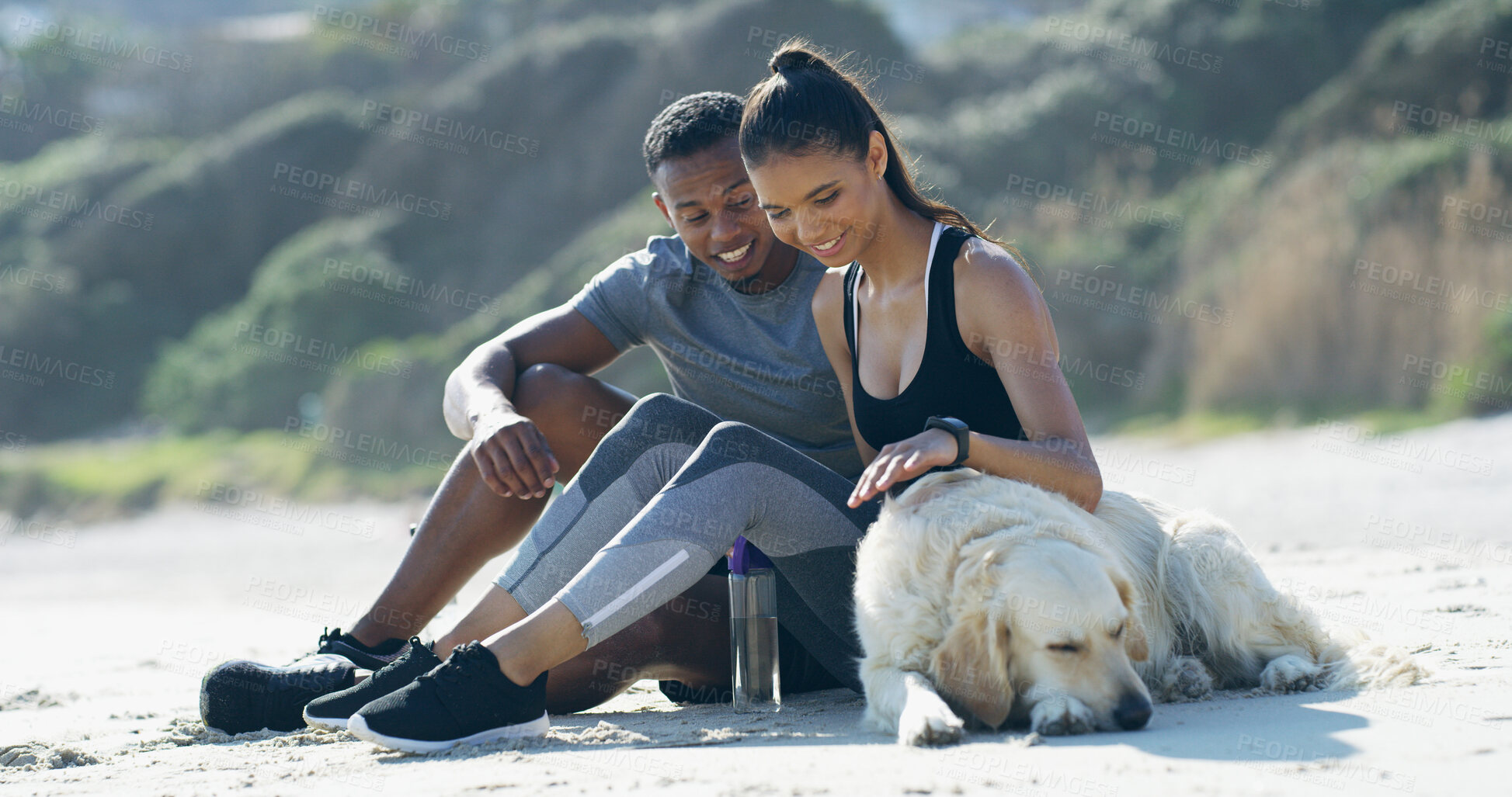 Buy stock photo Relax, beach and couple with dog in nature after training, exercise and workout for health together outdoors. Dating, pet owners and man and woman with Labrador on sand for resting, break and calm