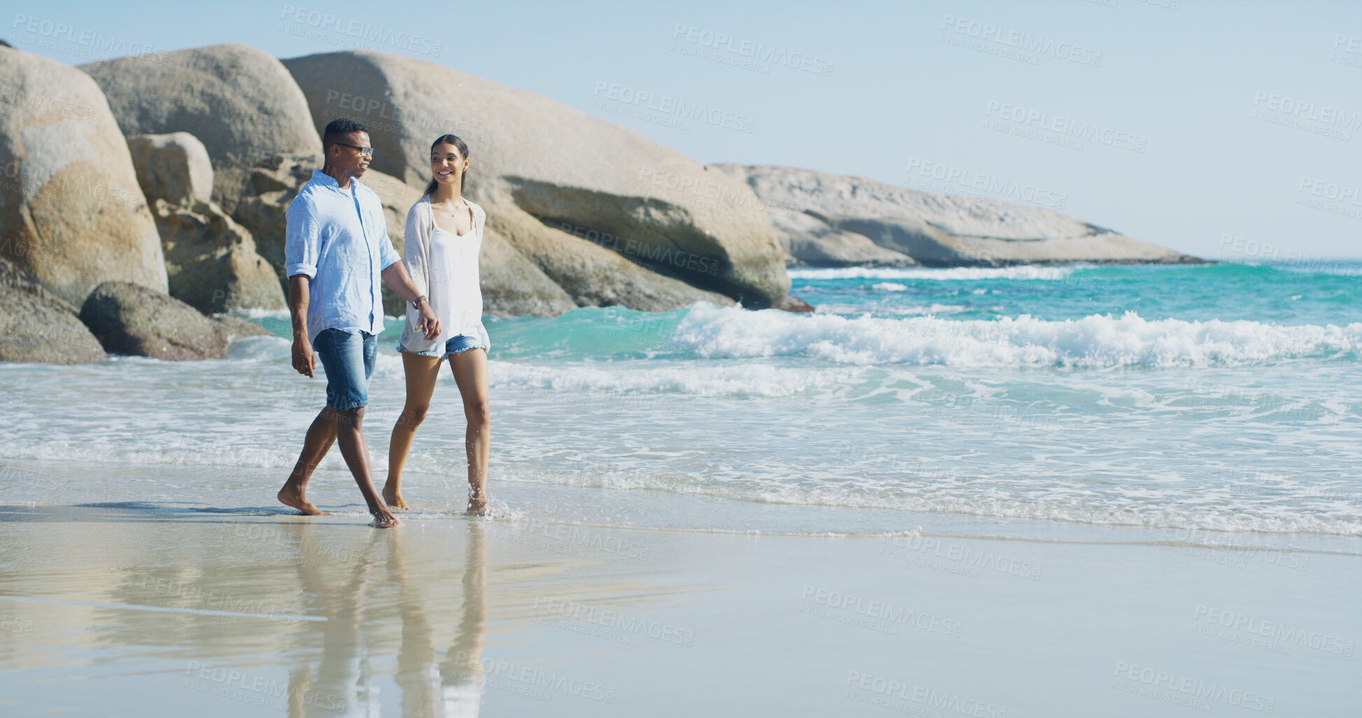 Buy stock photo Beach, couple and holding hands with walking for travel, vacation holiday and bonding together by sea. Happy people, woman and man with commitment in relationship, love and connection in Florida