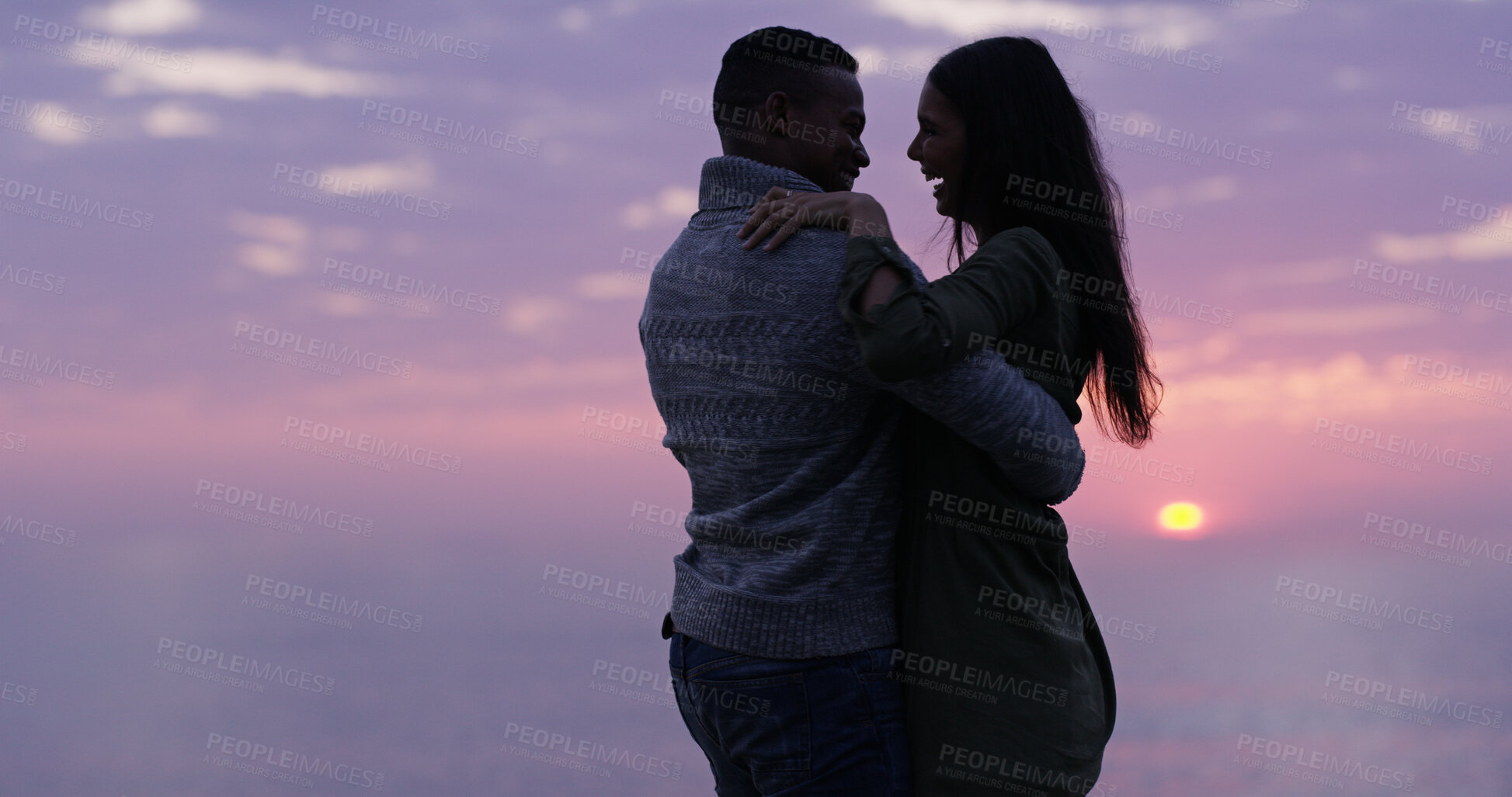 Buy stock photo Sunset, beach and couple embrace on romantic date, holiday adventure or happy in nature. Evening cloudy sky, man and woman on travel vacation with love, dance and outdoor journey together at ocean