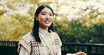 Japanese woman, portrait and outdoor with happiness confidence and pride in garden or park. Female person, smile and biology student at university for relax, calm and beauty in nature or countryside