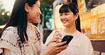 Travel, tourist and women in market, smartphone and journey for tourism, map and friendship in Tokyo. Outdoor, trip and people on vacation, mobile and adventure for traveller, holiday and Japan