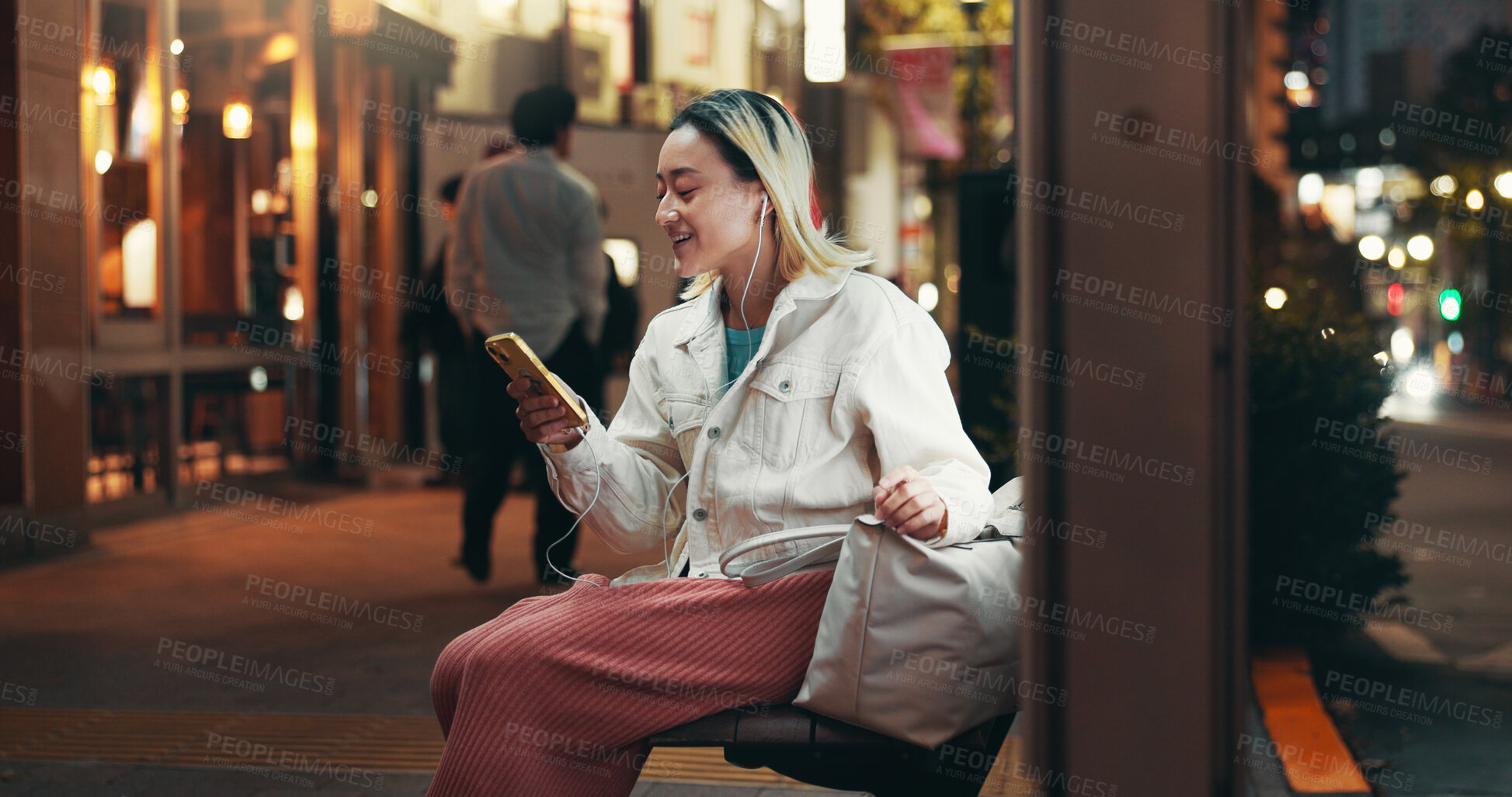 Buy stock photo Night, travel and woman at bus stop with phone, connection or checking online public transport schedule in city. Smartphone, search and Japanese girl in street with mobile app for late urban commute