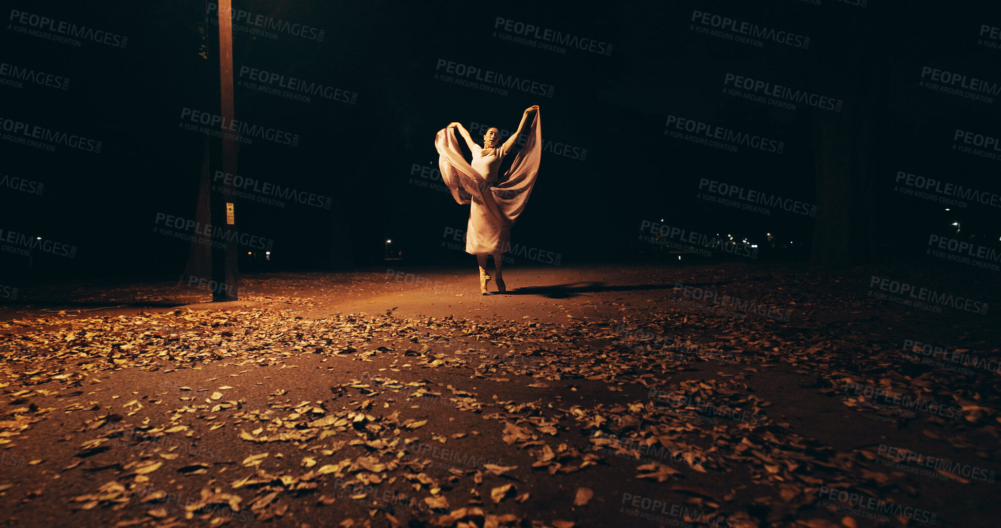 Buy stock photo Ballet, dance and artist with Japanese woman in city for balance, theater and elegant performance. Talent, night and feminine with person or ballerina dancer in street for recital and practice