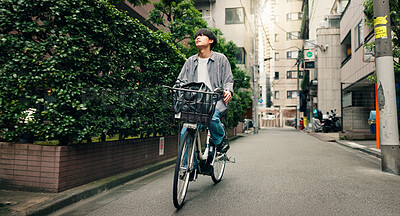 Buy stock photo Travel, basket and Asian man with bicycle in city for morning commute, adventure and journey outdoors. Location, cycling and person on bike for trip, sustainable and eco friendly transport in Japan