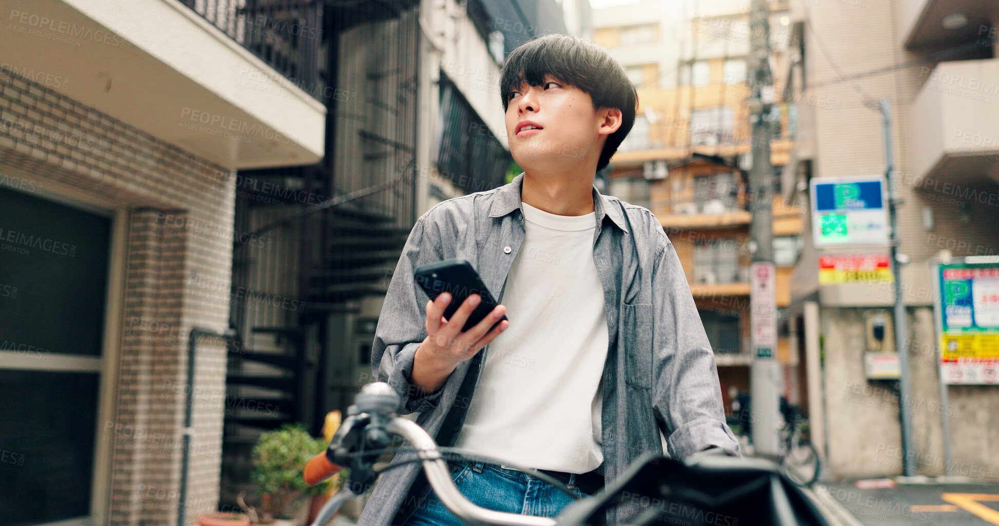 Buy stock photo Phone, bicycle and search with Japanese man in city for location, digital map and travel. Social media, cycling and mobile app with asian person and bike for networking, connection and adventure